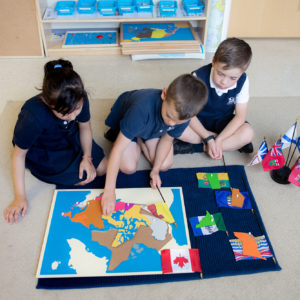 students using world map