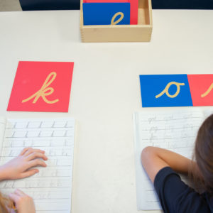 students using Montessori letters activity